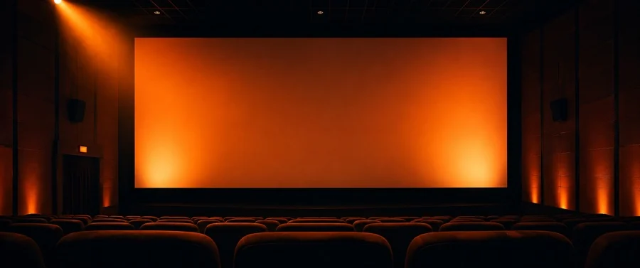 A cinema auditorium with the screen lit, the format theatre advertising is made for.